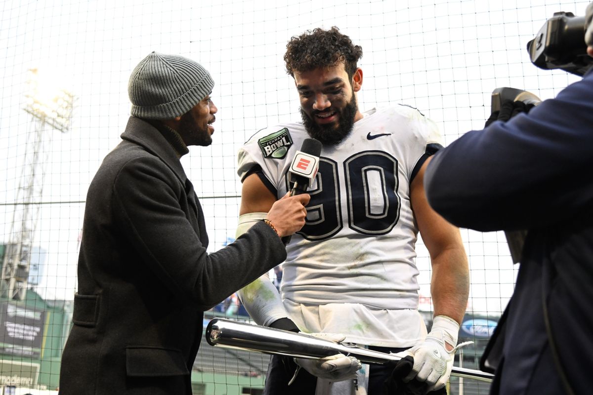 Dec 28, 2024; Boston, MA, USA; Connecticut Huskies defensive lineman Pryce Yates (90) is named the 2024 Fenway Bowl defensive MVP after defeating the North Carolina Tar Heels at Fenway Park. Mandatory Credit: Eric Canha-Imagn Images