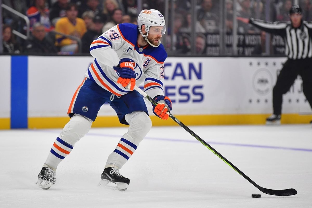 Dec 28, 2024; Los Angeles, California, USA; Edmonton Oilers center Leon Draisaitl (29) controls the puck against the Los Angeles Kings during the first period at Crypto.com Arena. Mandatory Credit: Gary A. Vasquez-Imagn Images