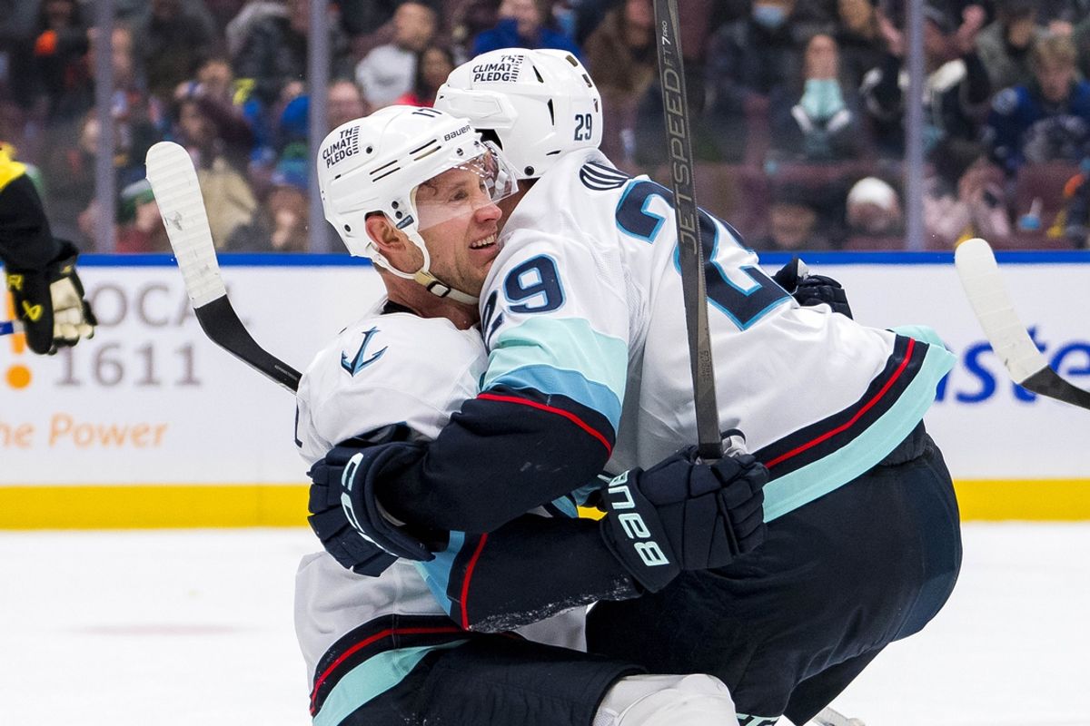 Dec 28, 2024; Vancouver, British Columbia, CAN; Seattle Kraken forward Jaden Schwartz (17) celebrates with defenseman Vince Dunn (29) after scoring the game tying goal against the Vancouver Canucks in the third period at Rogers Arena. Mandatory Credit: Bob Frid-Imagn Images