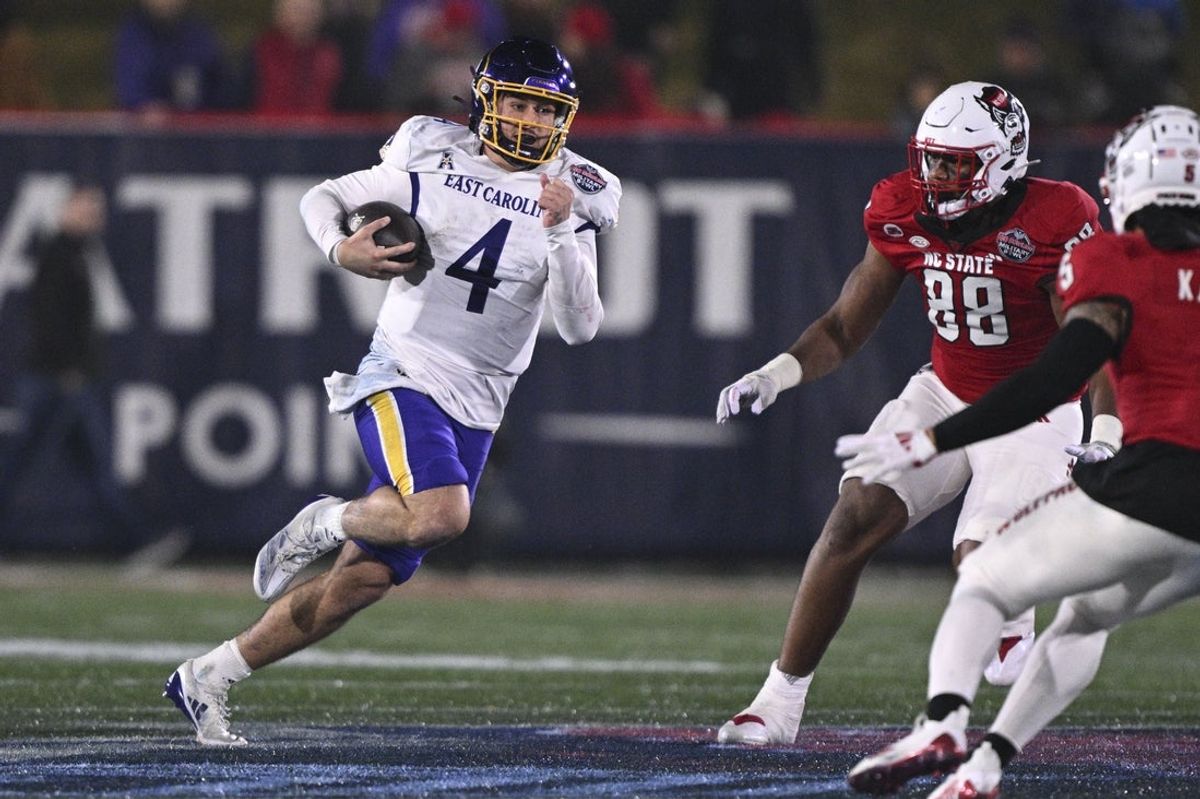 Dec 28, 2024; Annapolis, MD, USA;  East Carolina Pirates quarterback Katin Houser (4) rushe during the second half of the  Go Bowling Military Bowl  against the North Carolina State Wolfpack at Navy-Marine Corps Memorial Stadium. Mandatory Credit: Tommy Gilligan-Imagn Images