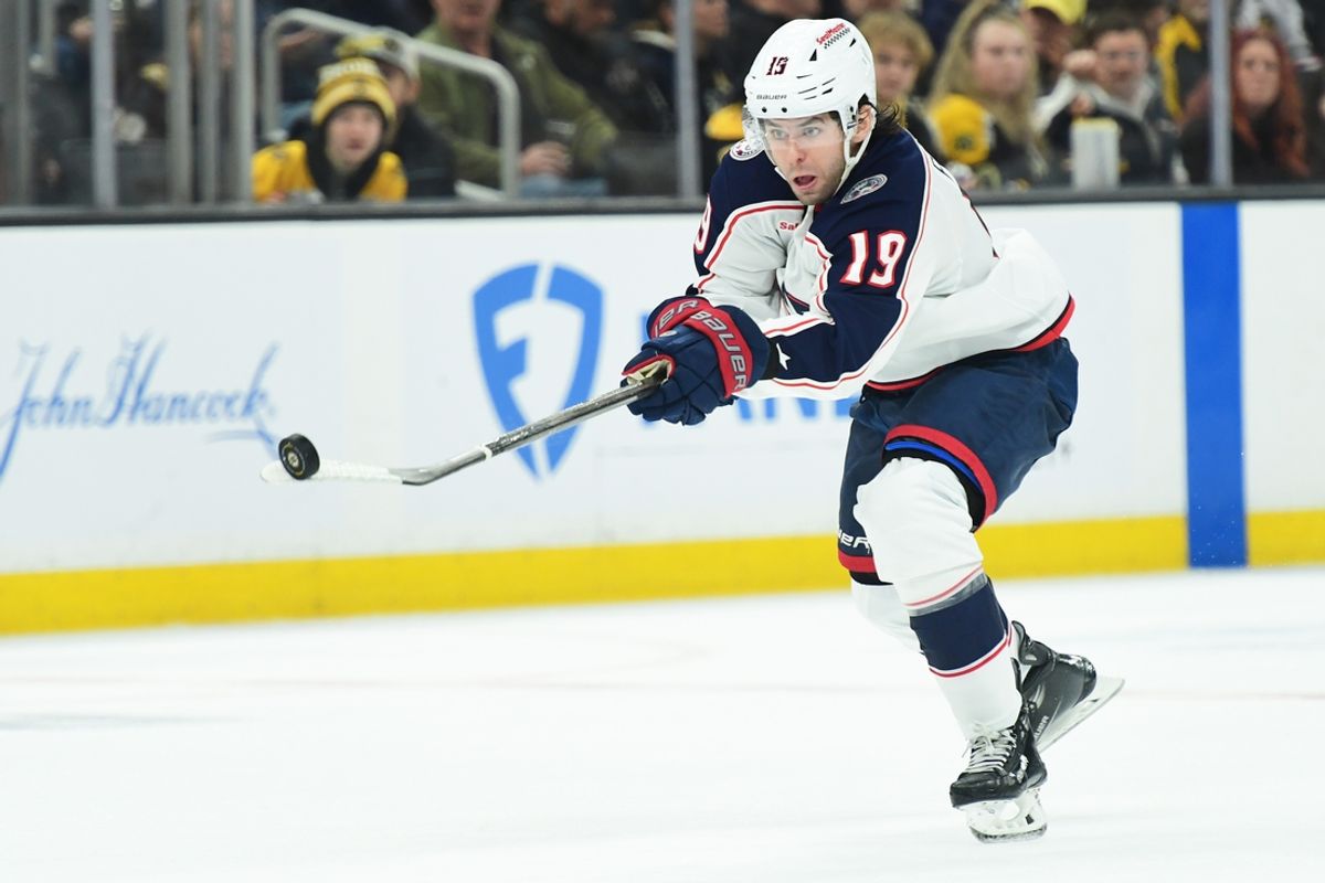Dec 28, 2024; Boston, Massachusetts, USA;  Columbus Blue Jackets center Adam Fantilli (19) tips the puck with the blade of his stick during the second period against the Boston Bruins at TD Garden. Mandatory Credit: Bob DeChiara-Imagn Images