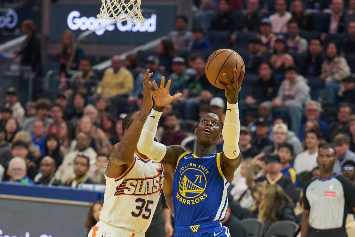 Dec 28, 2024; San Francisco, California, USA; Golden State Warriors guard Dennis Schroder (71) shoots the ball against Phoenix Suns forward Kevin Durant (35) (obscured) during the first quarter at Chase Center. Mandatory Credit: Robert Edwards-Imagn Images