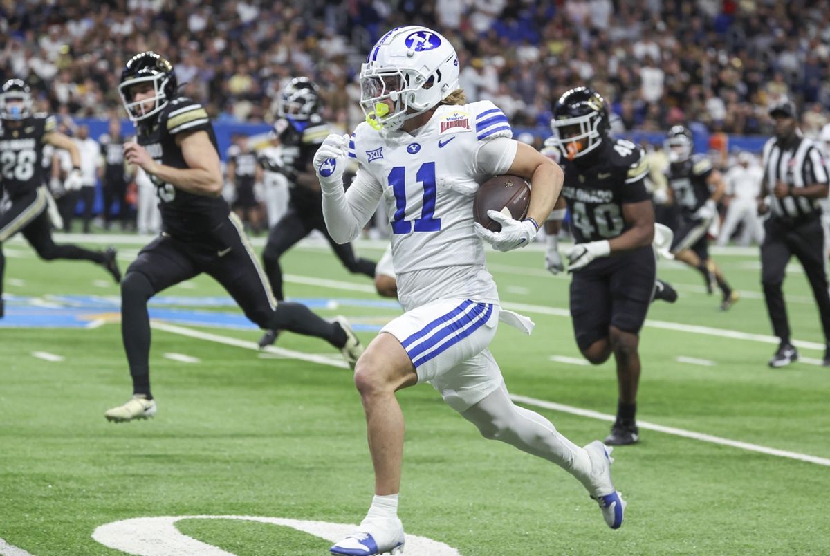 Dec 28, 2024; San Antonio, TX, USA; Brigham Young Cougars wide receiver Parker Kingston (11) returns a punt for a touchdown during the second quarter against the Colorado Buffaloes at Alamodome. Mandatory Credit: Troy Taormina-Imagn Images