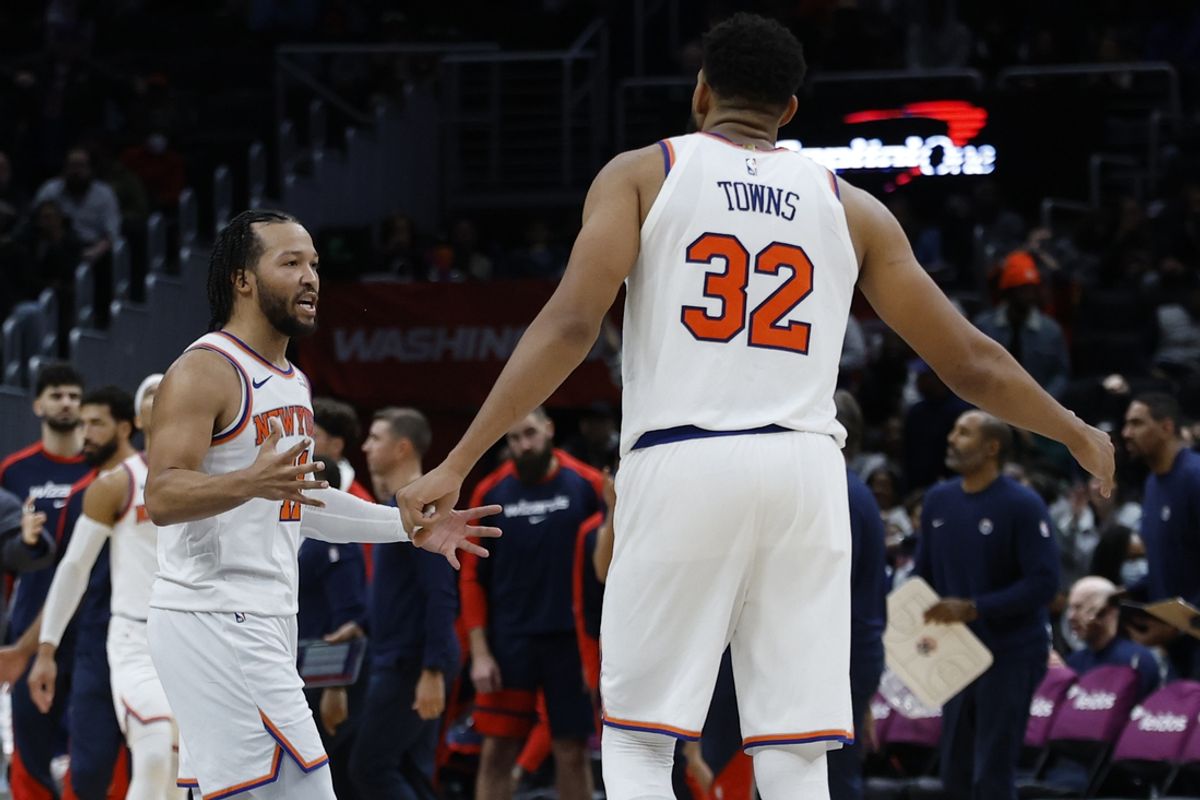Dec 28, 2024; Washington, District of Columbia, USA; New York Knicks guard Jalen Brunson (11) celebrates with Knicks center Karl-Anthony Towns (32) against the Washington Wizards in the fourth quarter at Capital One Arena. Mandatory Credit: Geoff Burke-Imagn Images