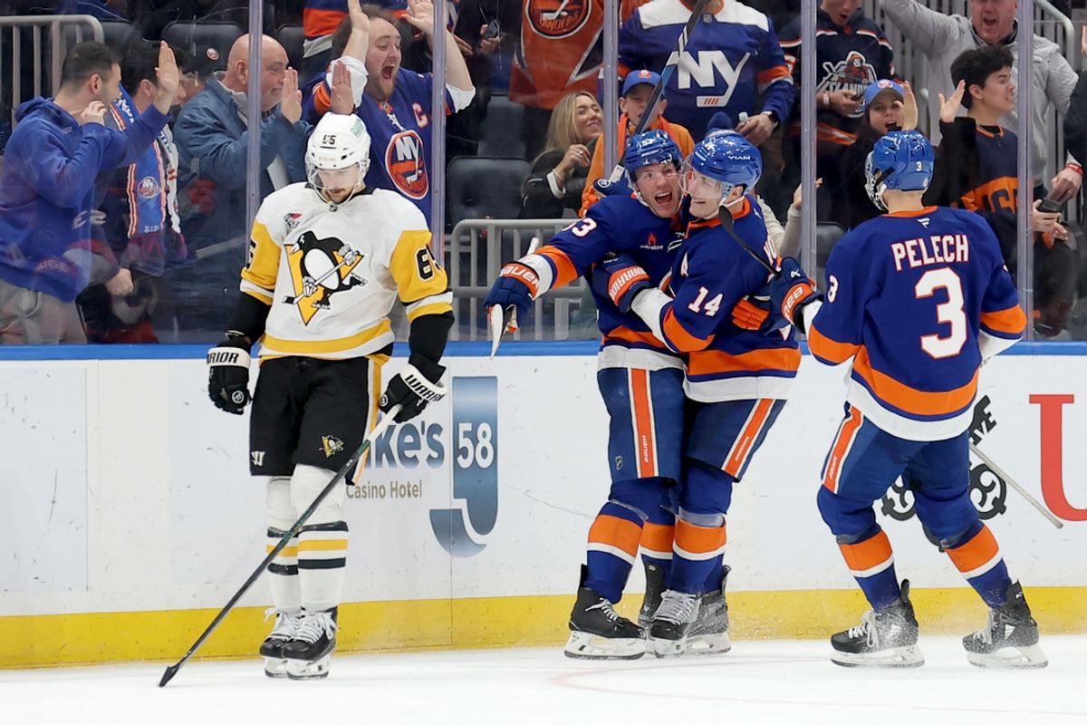 Dec 28, 2024; Elmont, New York, USA; New York Islanders center Casey Cizikas (53) celebrates his goal against the Pittsburgh Penguins with center Bo Horvat (14) and defenseman Adam Pelech (3) during the third period at UBS Arena. Mandatory Credit: Brad Penner-Imagn Images