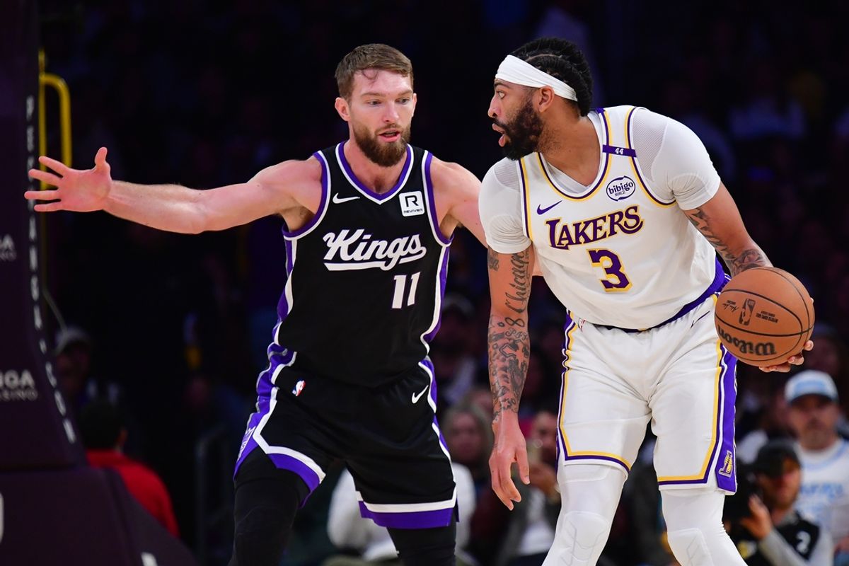 Dec 28, 2024; Los Angeles, California, USA; Los Angeles Lakers forward Anthony Davis (3) controls the ball against Sacramento Kings forward Domantas Sabonis (11) during the first half at Crypto.com Arena. Mandatory Credit: Gary A. Vasquez-Imagn Images