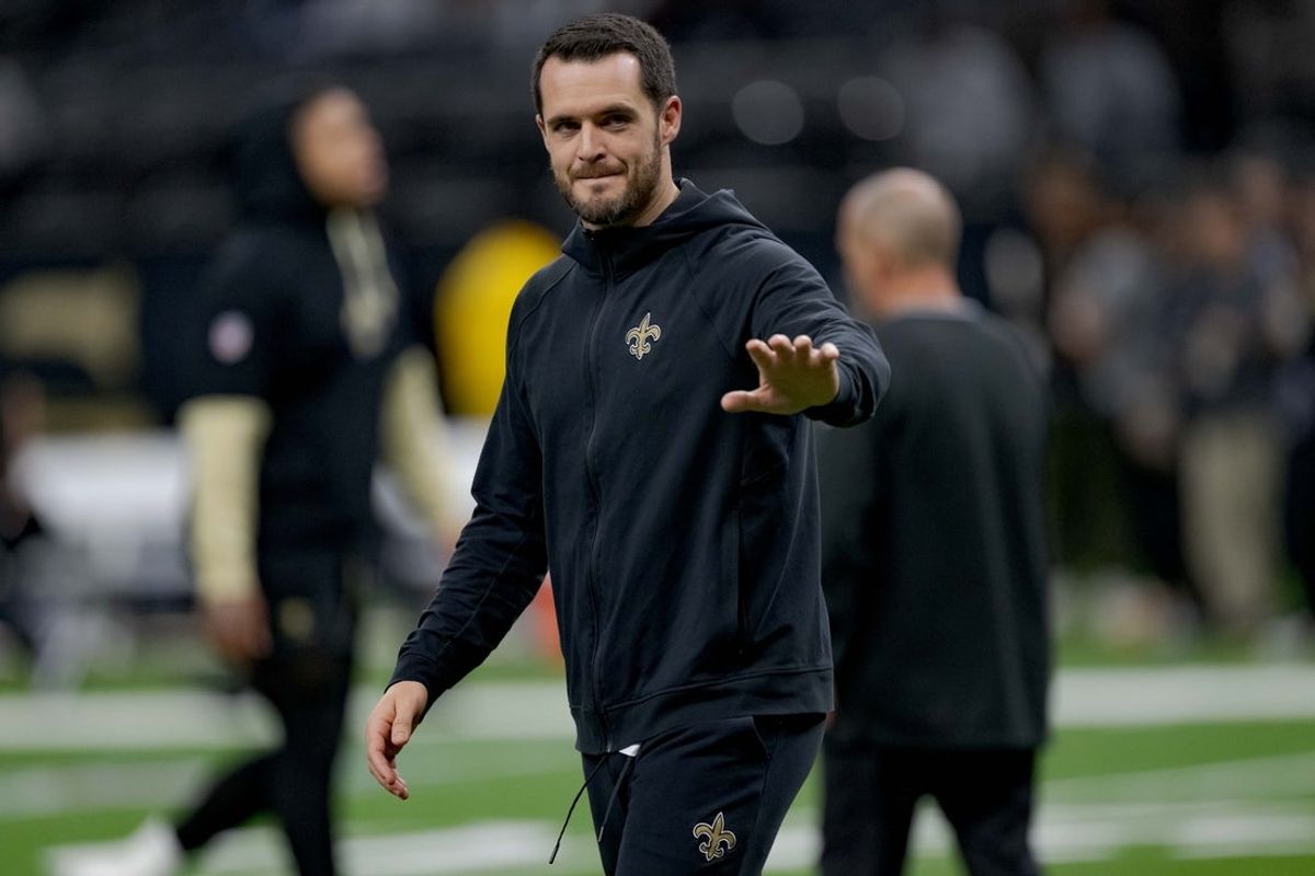 Dec 29, 2024; New Orleans, Louisiana, USA; New Orleans Saints quarterback Derek Carr (4) walks the field before a game against the Las Vegas Raiders at Caesars Superdome. Mandatory Credit: Matthew Hinton-Imagn Images