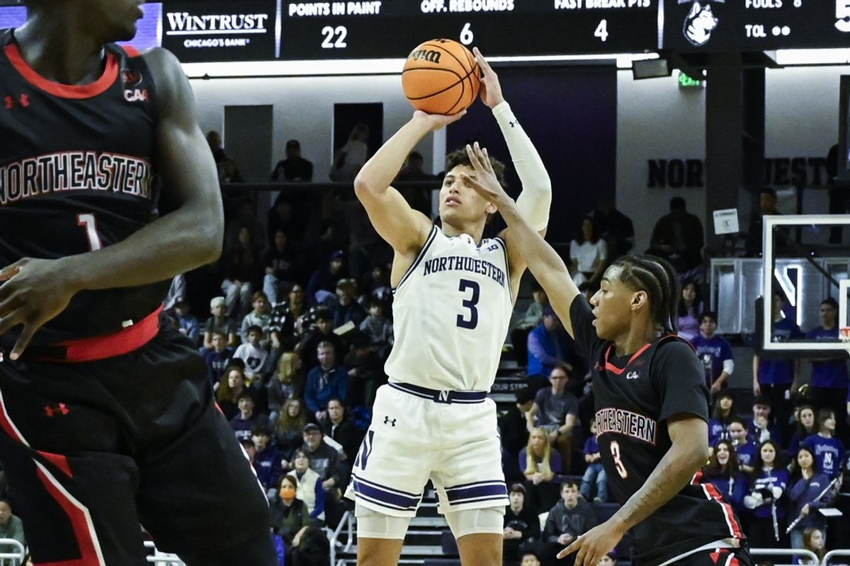 Dec 29, 2024; Evanston, Illinois, USA;  Northwestern Wildcats guard Ty Berry (3) scores a three point basket against Northeastern Huskies during the second half at Welsh-Ryan Arena. Mandatory Credit: Matt Marton-Imagn Images