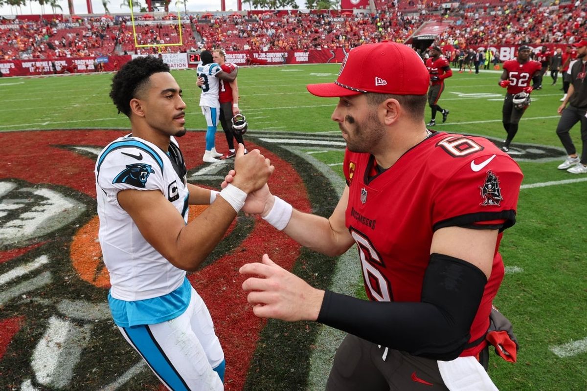 Dec 29, 2024; Tampa, Florida, USA; Tampa Bay Buccaneers quarterback Baker Mayfield (6) great Carolina Panthers quarterback Bryce Young (9) after a game at Raymond James Stadium. Mandatory Credit: Nathan Ray Seebeck-Imagn Images