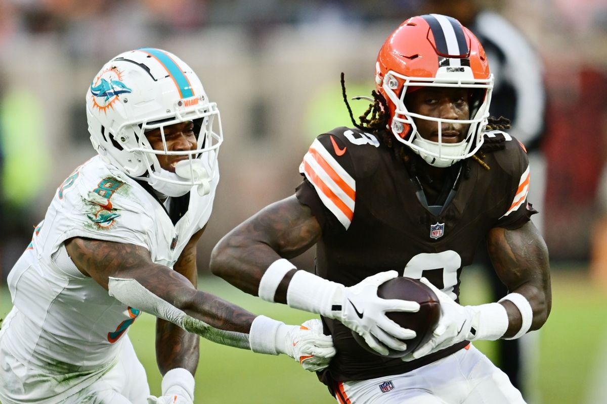 Dec 29, 2024; Cleveland, Ohio, USA; Cleveland Browns wide receiver Jerry Jeudy (3) runs with the ball after a catch as Miami Dolphins safety Jevon Holland (8) defends during the first half at Huntington Bank Field. Mandatory Credit: Ken Blaze-Imagn Images