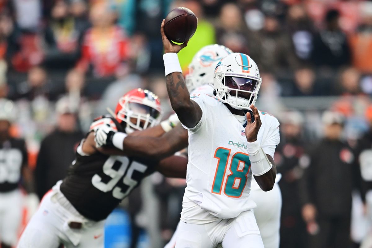 Dec 29, 2024; Cleveland, Ohio, USA; Miami Dolphins quarterback Tyler Huntley (18) throws a pass during the first half against the Cleveland Browns at Huntington Bank Field. Mandatory Credit: Ken Blaze-Imagn Images