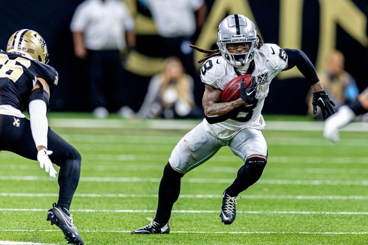 Dec 29, 2024; New Orleans, Louisiana, USA;  Las Vegas Raiders running back Ameer Abdullah (8) rushes against New Orleans Saints cornerback Travion Fluellen (26) during the second half at Caesars Superdome. Mandatory Credit: Stephen Lew-Imagn Images