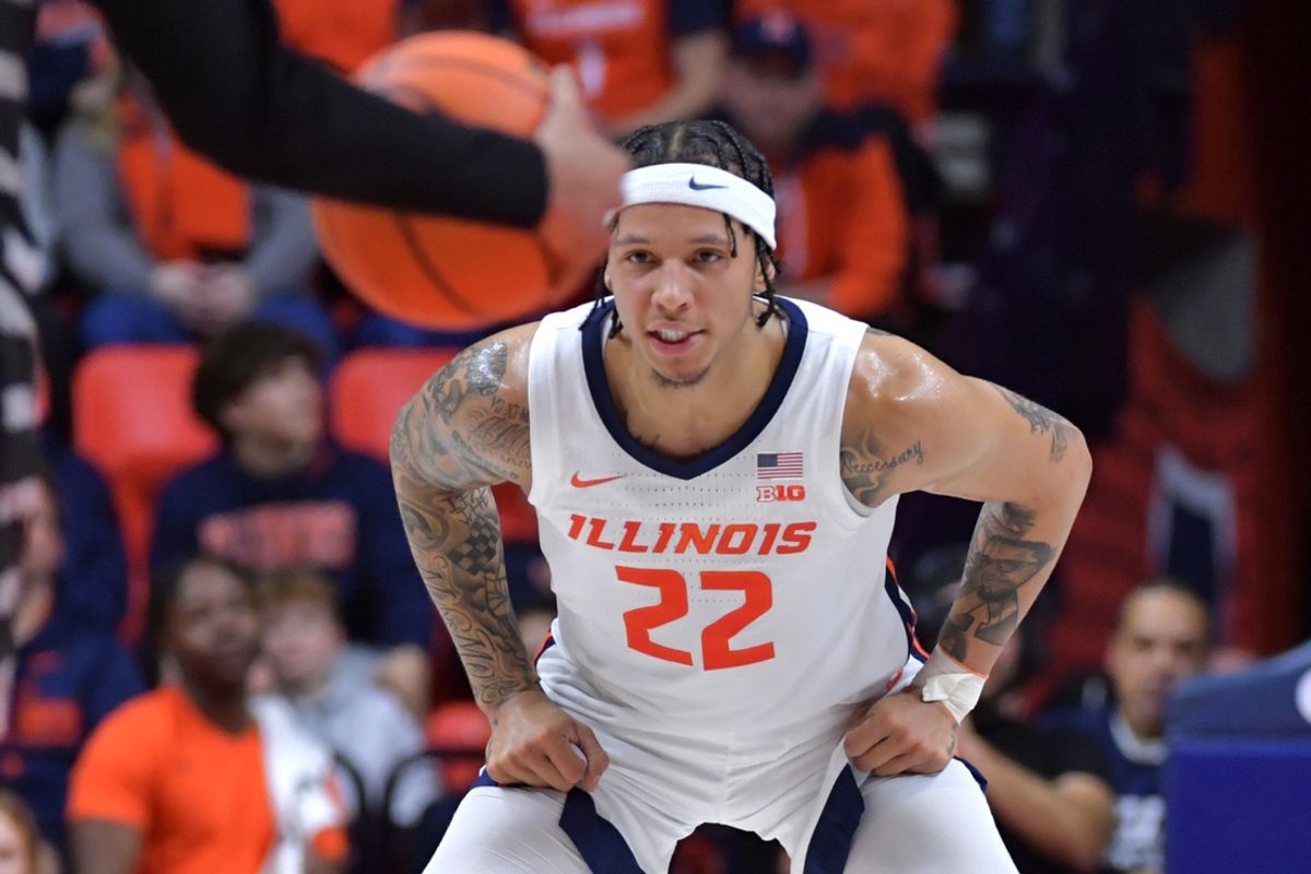 Dec 29, 2024; Champaign, Illinois, USA;  Illinois Fighting Illini guard Tre White (22) eyes the ball during the first half against the Chicago State Cougars at State Farm Center. Mandatory Credit: Ron Johnson-Imagn Images