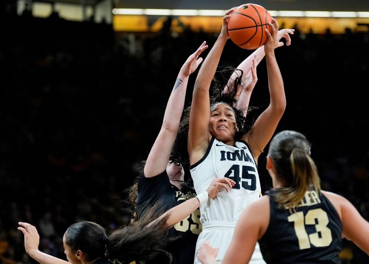 Iowa Hawkeyes forward Hannah Stuelke (45) secures a rebound against Purdue Boilermakers forward Lana McCarthy (35) Sunday, Dec. 29, 2024 at Carver-Hawkeye Arena in Iowa City, Iowa.
