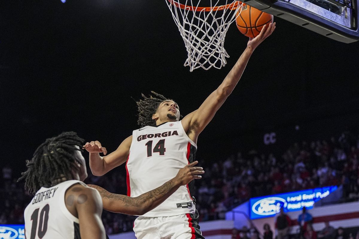 Dec 29, 2024; Athens, Georgia, USA; Georgia Bulldogs forward Asa Newell (14) lays in a basket against the South Carolina State Bulldogs during the second half at Stegeman Coliseum. Mandatory Credit: Dale Zanine-Imagn Images