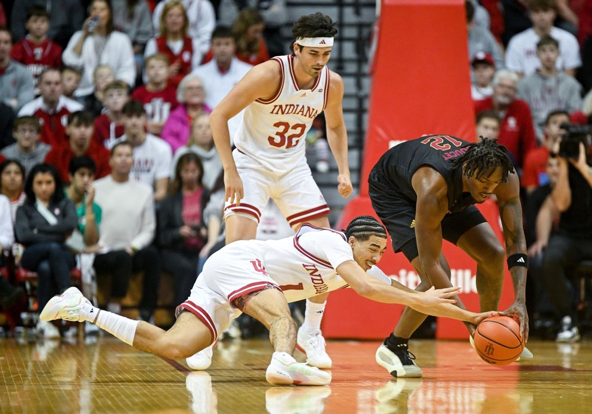 Dec 29, 2024; Bloomington, Indiana, USA;  Indiana Hoosiers guard Myles Rice (1) recovers a loose ball in front of Winthrop Eagles forward K.J. Doucet (12) during the first half at Simon Skjodt Assembly Hall. Mandatory Credit: Robert Goddin-Imagn Images