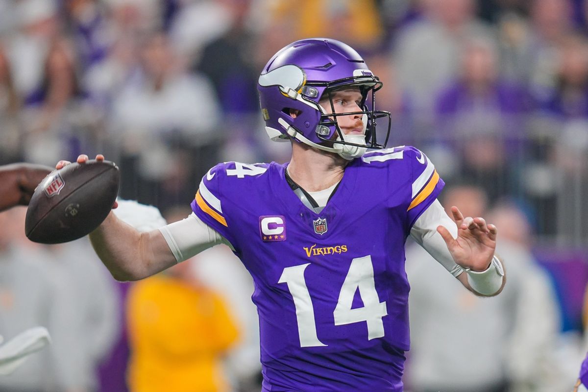 Dec 29, 2024; Minneapolis, Minnesota, USA; Minnesota Vikings quarterback Sam Darnold (14) passes against Green Bay Packers in the second quarter at U.S. Bank Stadium. Mandatory Credit: Brad Rempel-Imagn Images