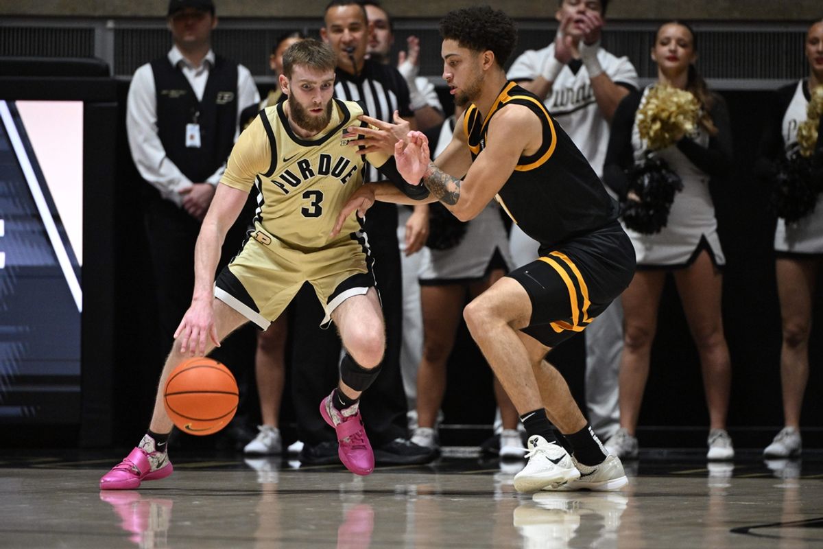 Dec 29, 2024; West Lafayette, Indiana, USA; Purdue Boilermakers guard Braden Smith (3) dribbles the ball against Toledo Rockets guard Sam Lewis (11) during the first half at Mackey Arena. Mandatory Credit: Marc Lebryk-Imagn Images