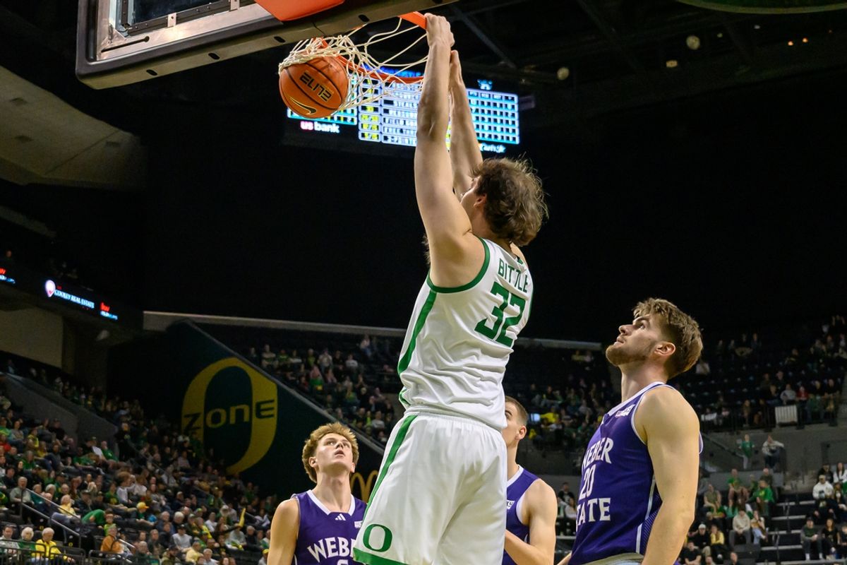 Dec 29, 2024; Eugene, Oregon, USA; Oregon Ducks center Nate Bittle (32) ducks the ball against the Weber State Wildcats during the second half at Matthew Knight Arena. Mandatory Credit: Craig Strobeck-Imagn Images