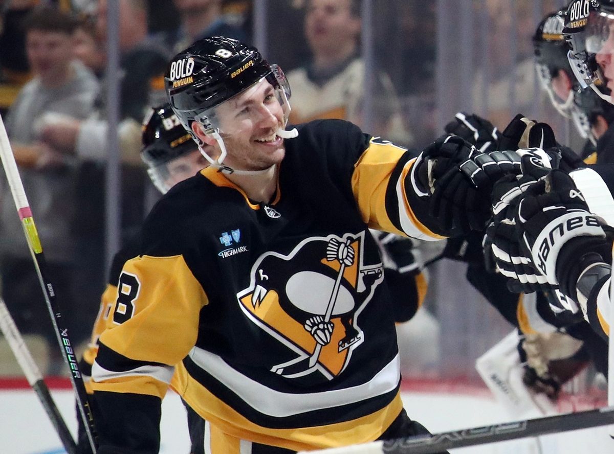 Dec 29, 2024; Pittsburgh, Pennsylvania, USA;  Pittsburgh Penguins left wing Michael Bunting (8) celebrates his goal with the Penguins bench against the New York Islanders during the second period at PPG Paints Arena. Mandatory Credit: Charles LeClaire-Imagn Images