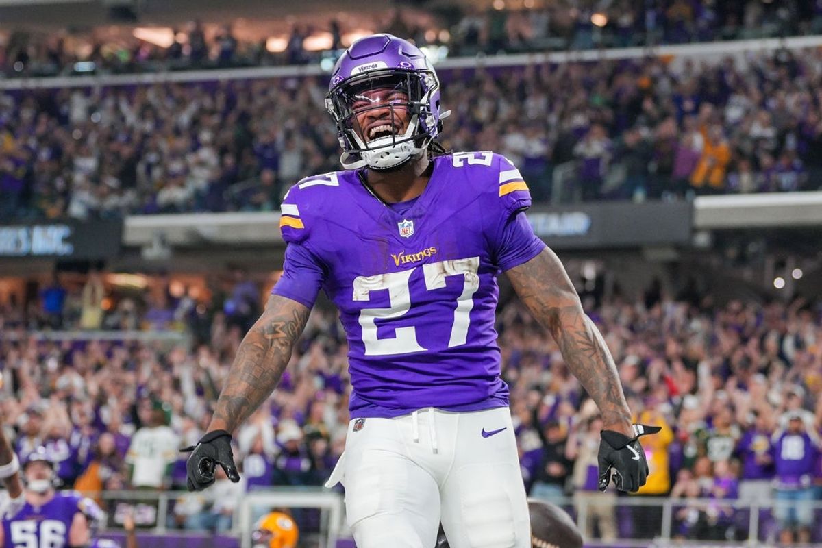 Dec 29, 2024; Minneapolis, Minnesota, USA; Minnesota Vikings running back Cam Akers (27) celebrates his touchdown against Green Bay Packers in the third quarter at U.S. Bank Stadium. Mandatory Credit: Brad Rempel-Imagn Images