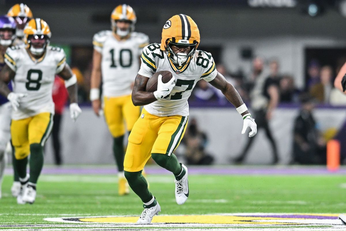 Dec 29, 2024; Minneapolis, Minnesota, USA; Green Bay Packers wide receiver Romeo Doubs (87) gets yards after the catch against the Minnesota Vikings during the fourth quarter at U.S. Bank Stadium. Mandatory Credit: Jeffrey Becker-Imagn Images