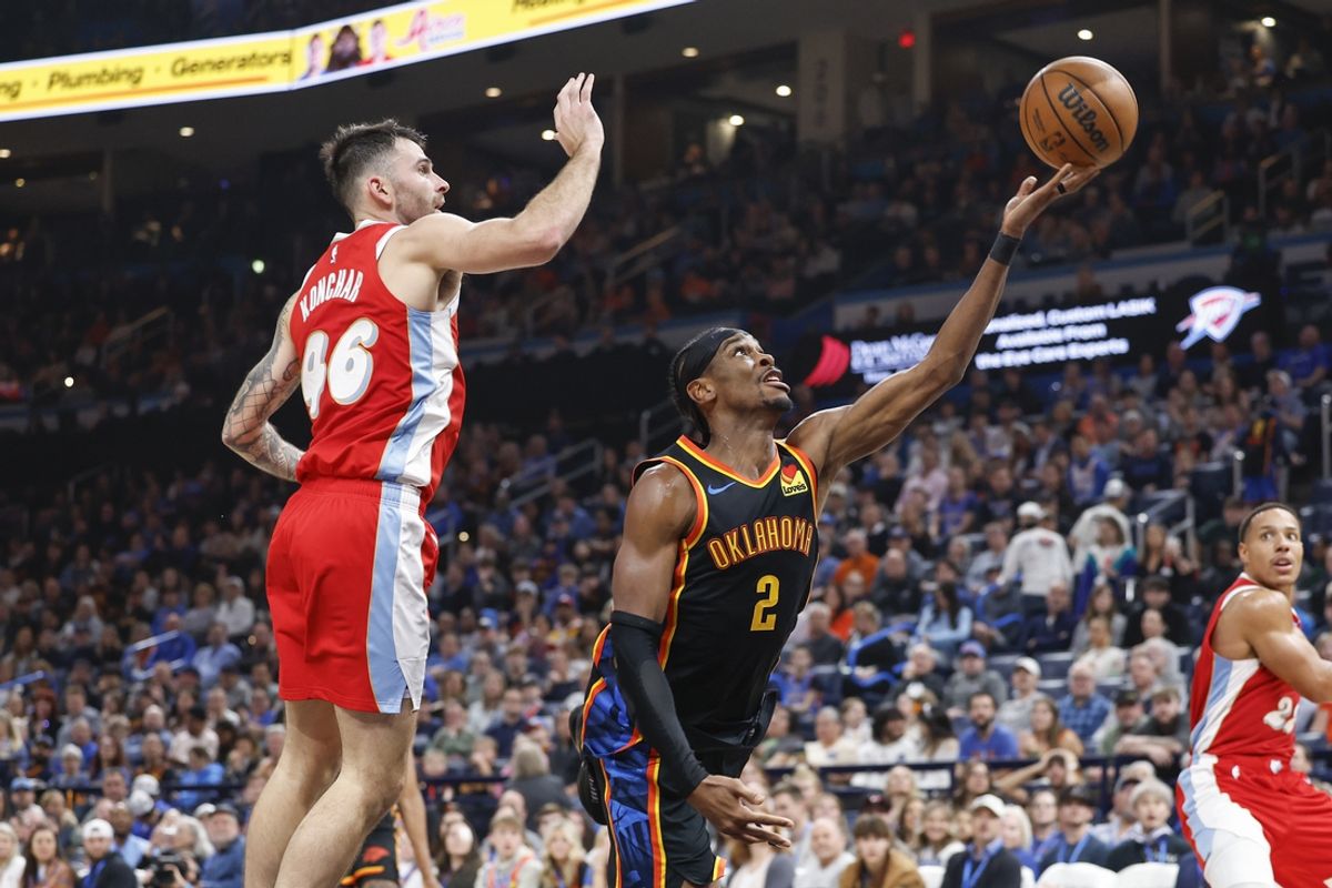 Dec 29, 2024; Oklahoma City, Oklahoma, USA; Oklahoma City Thunder guard Shai Gilgeous-Alexander (2) shoots in front of Memphis Grizzlies guard John Konchar (46) during the second quarter at Paycom Center. Mandatory Credit: Alonzo Adams-Imagn Images