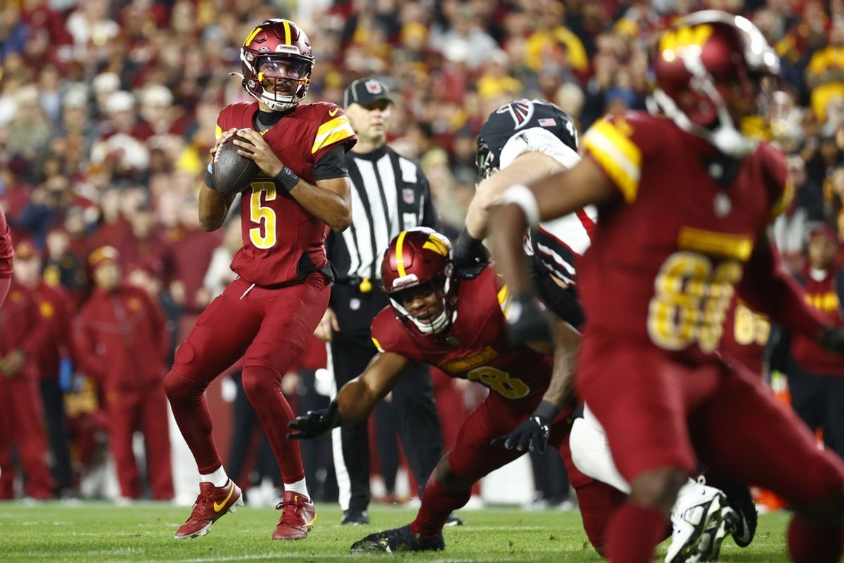 Dec 29, 2024; Landover, Maryland, USA; Washington Commanders quarterback Jayden Daniels (5) prepares to throw the ball against the Atlanta Falcons during the first half at Northwest Stadium. Mandatory Credit: Amber Searls-Imagn Images