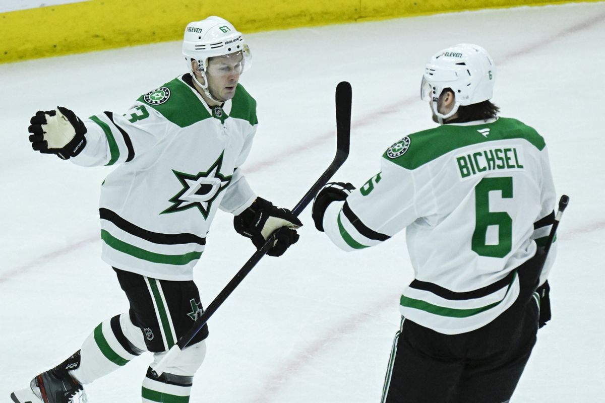 Dec 29, 2024; Chicago, Illinois, USA;  Dallas Stars right wing Evgenii Dadonov (63) celebrates his goal against the Chicago Blackhawks with defenseman Lian Bichsel (6)  during the second period at United Center. Mandatory Credit: Matt Marton-Imagn Images