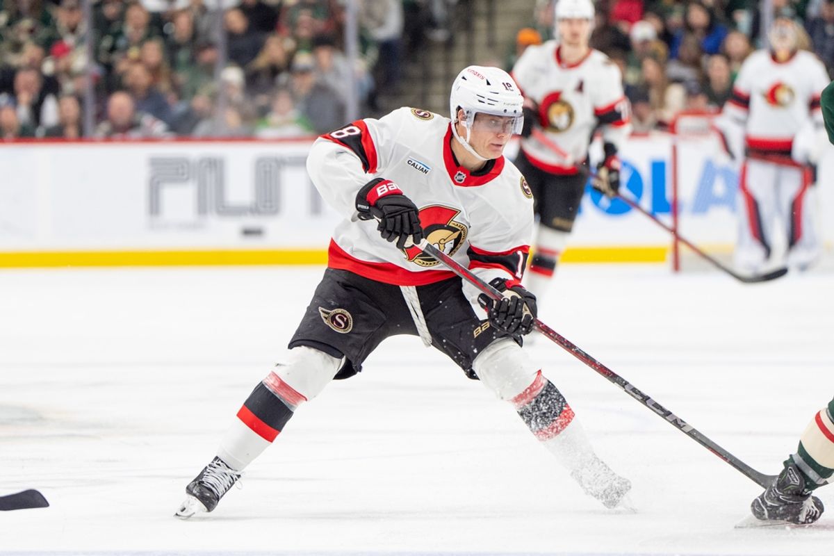 Dec 29, 2024; Saint Paul, Minnesota, USA; Ottawa Senators center Tim Stutzle (18) brings the puck over the blue line against the Minnesota Wild in the third period at Xcel Energy Center. Mandatory Credit: Matt Blewett-Imagn Images