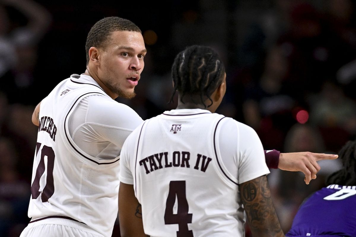 Dec 28, 2024; College Station, Texas, USA; Texas A&M Aggies guard CJ Wilcher (10) speaks with guard Wade Taylor IV (4) during the second half against the Abilene Christian Wildcats at Reed Arena. The Aggies defeated the Wildcats 92-54. Mandatory Credit: Maria Lysaker-Imagn Images