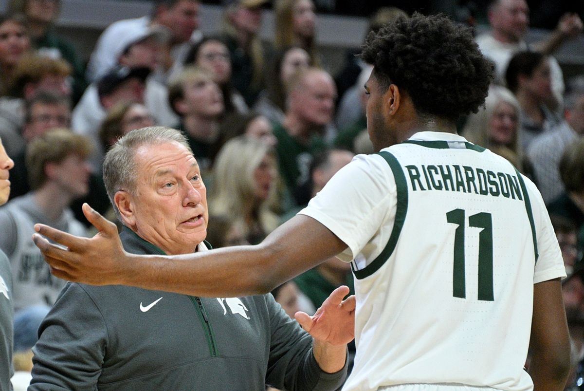 Dec 30, 2024; East Lansing, Michigan, USA; Michigan State Spartans guard Jase Richardson (11) talks with head coach Tom Izzo against the Western Michigan Broncos at Jack Breslin Student Events Center. Mandatory Credit: Dale Young-Imagn Images