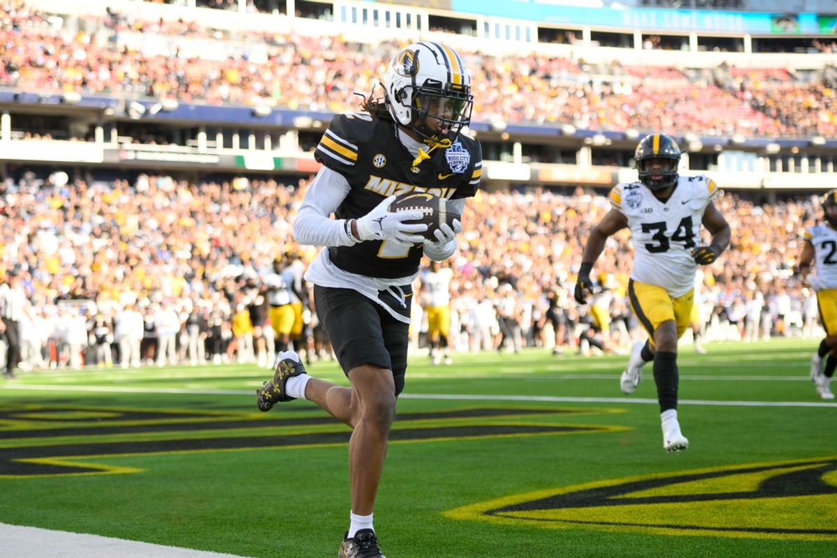 Dec 30, 2024; Nashville, TN, USA;  Missouri Tigers wide receiver Marquis Johnson (2) makes a catch for a touchdown against the Iowa Hawkeyes  during the first half at Nissan Stadium. Mandatory Credit: Steve Roberts-Imagn Images