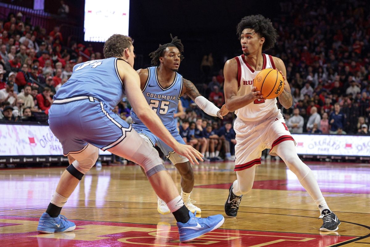 Dec 30, 2024; Piscataway, New Jersey, USA; Rutgers Scarlet Knights guard Dylan Harper (2) looks to pass as Columbia Lions guard Avery Brown (25) and forward Jake Tavroff (34) defend during the second half at Jersey Mike's Arena. Mandatory Credit: Vincent Carchietta-Imagn Images