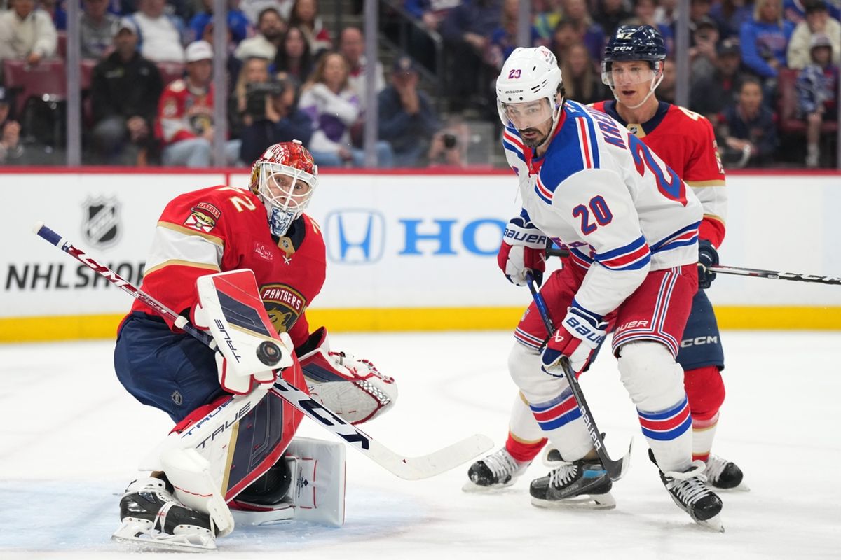 Dec 30, 2024; Sunrise, Florida, USA;  Florida Panthers goaltender Sergei Bobrovsky (72) makes a save as New York Rangers left wing Chris Kreider (20) looks for the rebound during the first period at Amerant Bank Arena. Mandatory Credit: Jim Rassol-Imagn Images