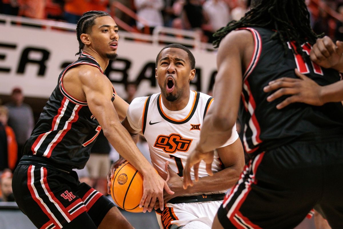 Dec 30, 2024; Stillwater, Oklahoma, USA; Oklahoma State Cowboys guard Bryce Thompson (1) drives to the basket during the first half against the Houston Cougars at Gallagher-Iba Arena. Mandatory Credit: William Purnell-Imagn Images