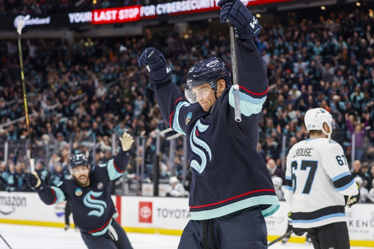 Dec 30, 2024; Seattle, Washington, USA; Seattle Kraken left wing Andre Burakovsky (95) celebrates after scoring a goal against the Utah Hockey Club during the first period at Climate Pledge Arena. Mandatory Credit: Joe Nicholson-Imagn Images