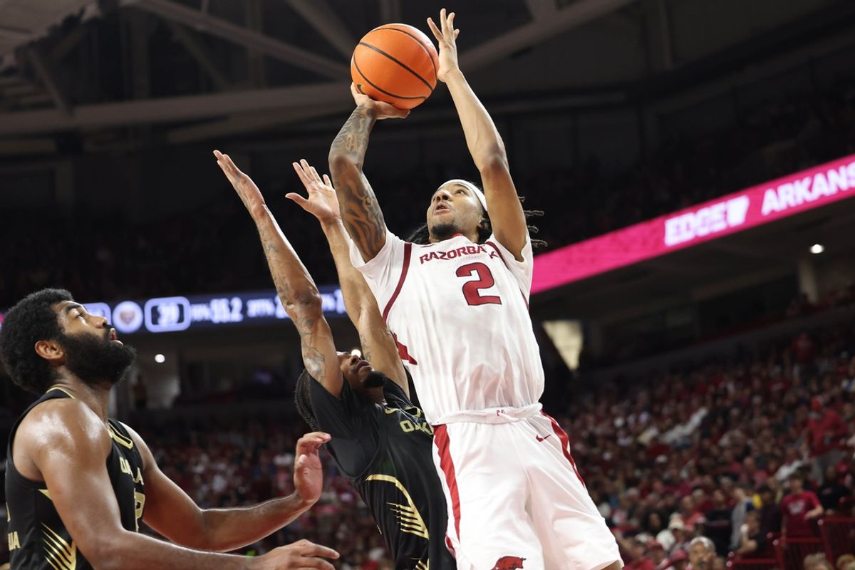 Dec 30, 2024; Fayetteville, Arkansas, USA; Arkansas Razorbacks guard Boogie Fland (2) shoots a shot as time  expires in the first half against the Oakland Golden Grizzlies at Bud Walton Arena. Mandatory Credit: Nelson Chenault-Imagn Images