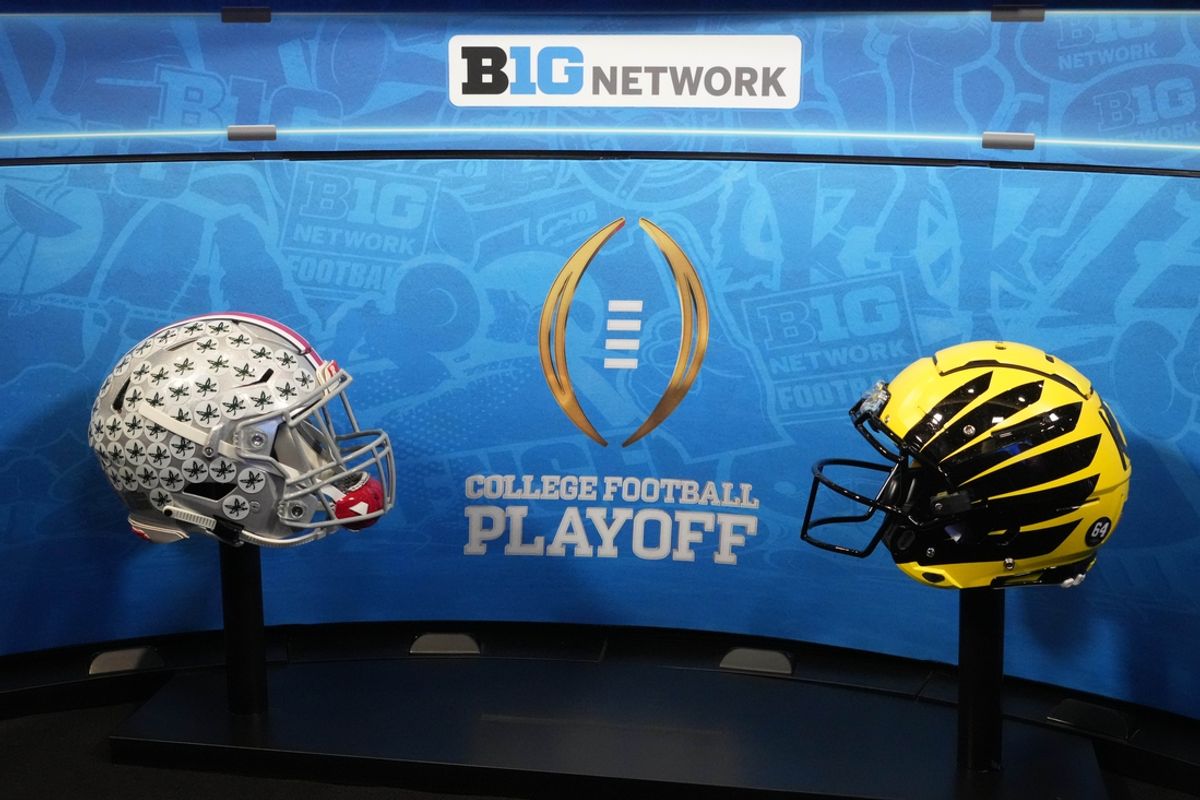 Dec 30, 2024; Los Angeles, CA, USA; Ohio State Buckeyes and Oregon Ducks helmets with the College Football Playoff (CFP) logo on the Big Ten Network stage during Rose Bowl media day at Sheraton Grand LA. Mandatory Credit: Kirby Lee-Imagn Images