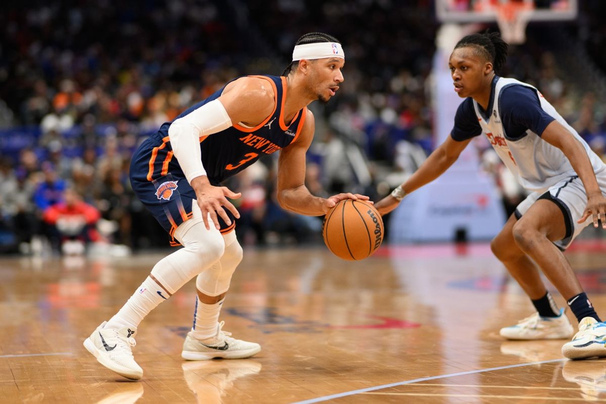 Dec 30, 2024; Washington, District of Columbia, USA; New York Knicks guard Josh Hart (3) handles the ball against Washington Wizards guard Carlton Carrington (8) during the second quarter at Capital One Arena. Mandatory Credit: Reggie Hildred-Imagn Images