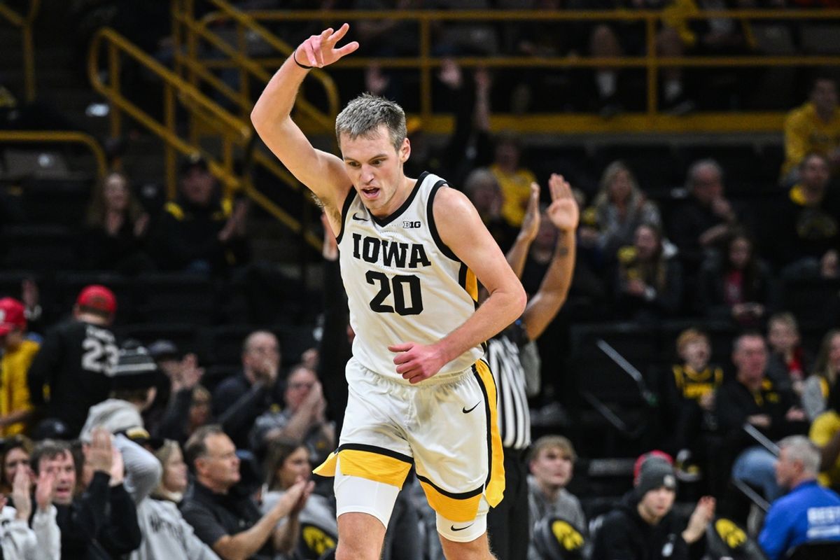 Dec 30, 2024; Iowa City, Iowa, USA; Iowa Hawkeyes forward Payton Sandfort (20) reacts during the first half against the New Hampshire Wildcats at Carver-Hawkeye Arena. Mandatory Credit: Jeffrey Becker-Imagn Images