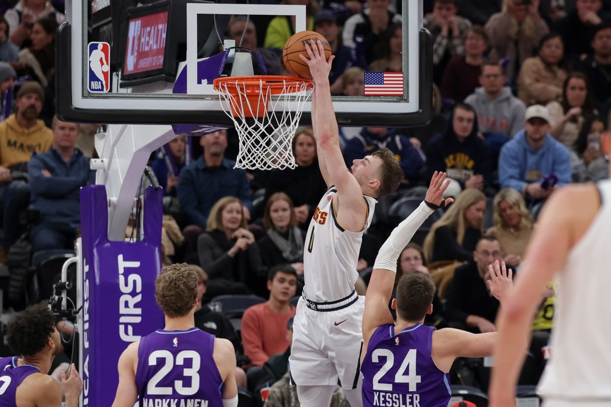 Dec 30, 2024; Salt Lake City, Utah, USA; Denver Nuggets center Nikola Jokic (15) dunks the ball during the second half against the Utah Jazz at Delta Center. Mandatory Credit: Chris Nicoll-Imagn Images