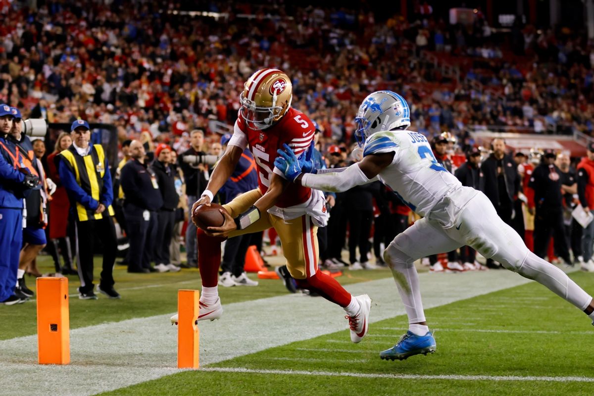 Dec 30, 2024; Santa Clara, California, USA; San Francisco 49ers quarterback Joshua Dobbs (5) scores a touchdown against the Detroit Lions during the fourth quarter at Levi's Stadium. Mandatory Credit: Sergio Estrada-Imagn Images