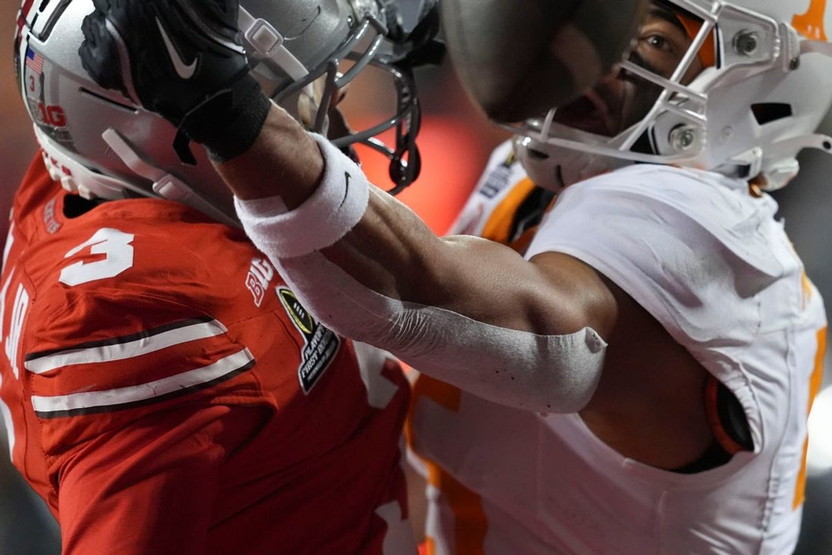 Ohio State cornerback Lorenzo Styles Jr. (3) breaks up a pass intended for Tennessee wide receiver Bru McCoy (5) during an NCAA college football playoff game on Saturday, Dec. 21, 2024, in Columbus, Ohio. (This is not a great photo but it is a good example to a too close-up action shot.)