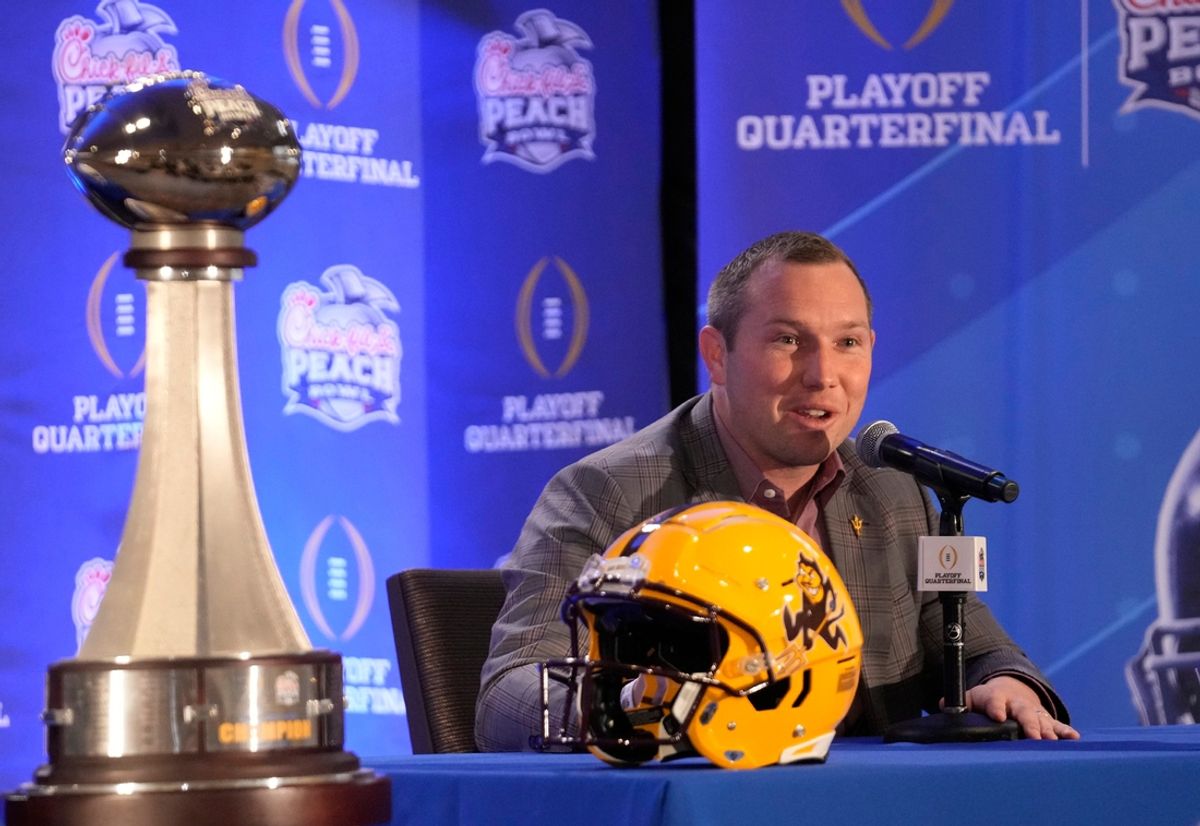 Arizona State head coach Kenny Dillingham responds to a question during a joint news conference with Texas head coach Steve Sarkisian before facing off in the Chick-fil-A Peach Bowl.