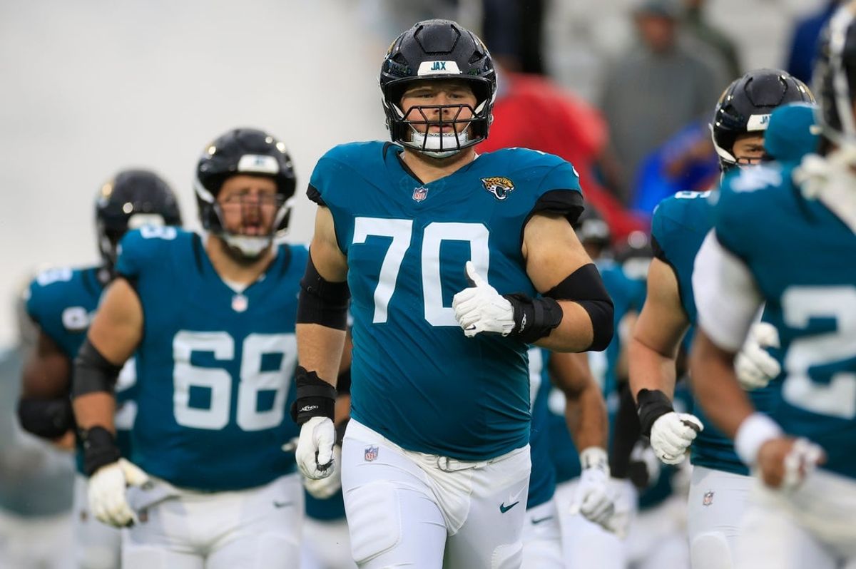 Jacksonville Jaguars offensive tackle Cole Van Lanen (70) runs on the field before an NFL football matchup Sunday, Dec. 29, 2024 at EverBank Stadium in Jacksonville, Fla. The Jaguars held off the Titans 20-13. [Corey Perrine/Florida Times-Union]