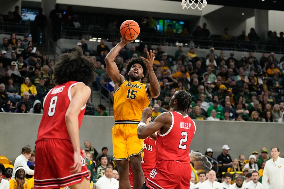 Dec 31, 2024; Waco, Texas, USA; Baylor Bears forward Norchad Omier (15) scores a basket over Utah Utes forward Ezra Ausar (2) during the second half at Paul and Alejandra Foster Pavilion. Mandatory Credit: Chris Jones-Imagn Images