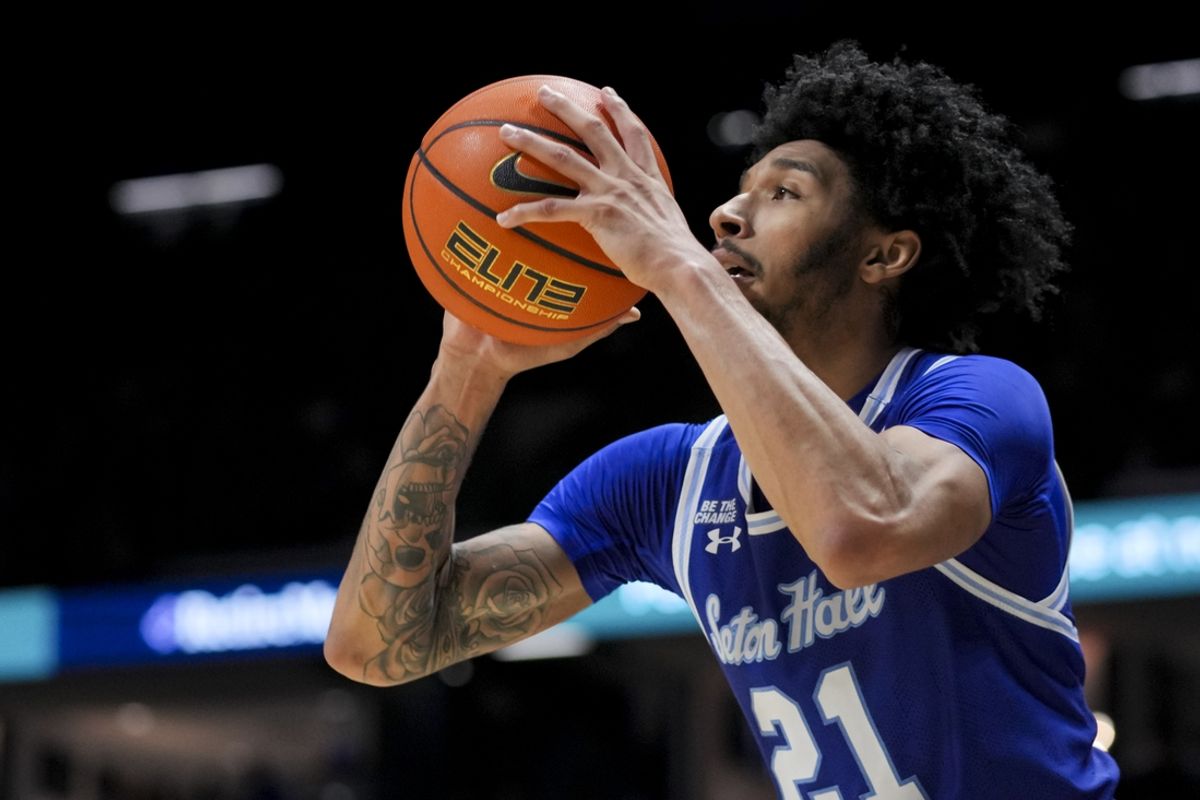 Dec 31, 2024; Cincinnati, Ohio, USA;  Seton Hall Pirates guard Isaiah Coleman (21) attempts a 3-point shot against the Xavier Musketeers in the second half at the Cintas Center. Mandatory Credit: Aaron Doster-Imagn Images