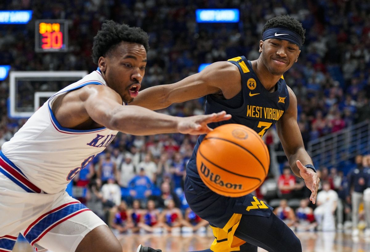 Dec 31, 2024; Lawrence, Kansas, USA; Kansas Jayhawks guard David Coit (8) steals the ball from West Virginia Mountaineers guard KJ Tenner (3) during the second half at Allen Fieldhouse. Mandatory Credit: Jay Biggerstaff-Imagn Images