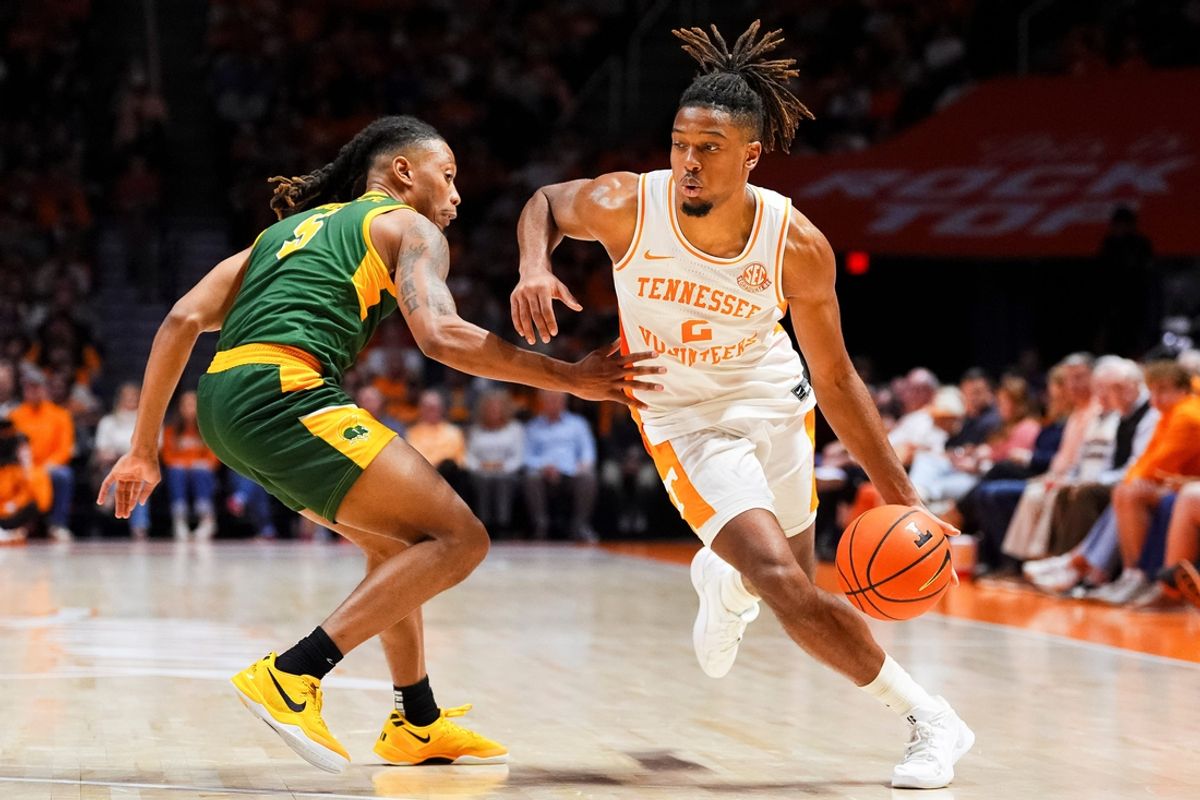 Tennessee guard Chaz Lanier (2) moves past Norfolk State guard Brian Moore Jr. (5) during a college basketball game between Tennessee and Norfolk State held at Thompson-Boling Arena at Food City Center in Knoxville, Tenn., on Tuesday, Dec. 31, 2024.